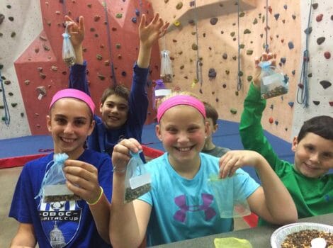 teens at a rock climbing gym