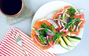 Bagel with lox and cup of coffee