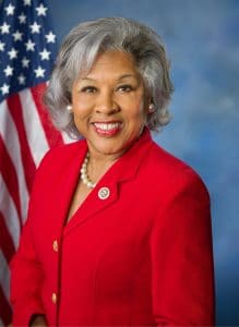 Rep. Joyce Beatty (D-OH) in red blazer in front of US flag