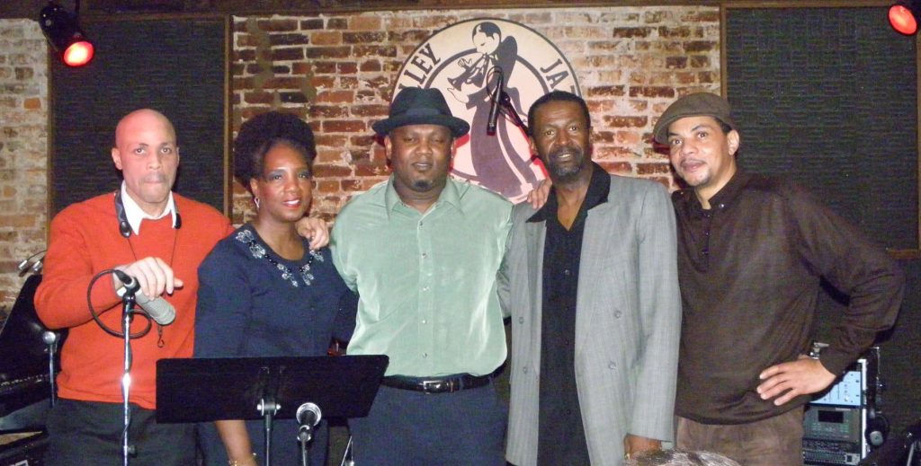 Five musicians stand onstage at Blues Alley.