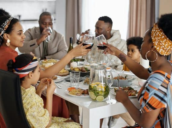Black family having dinner and celebrating