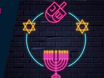 graphic of dreidel and menorah on blue background