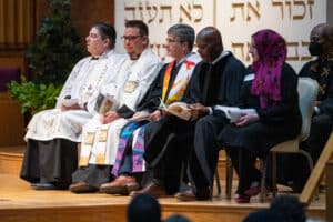 Clergy from different faiths on the bima