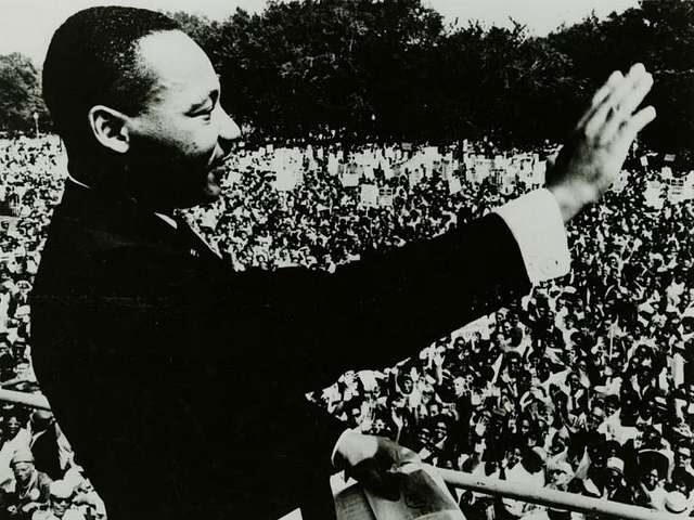 Dr. Martin Luther King Jr. waves to the crowd during the March on Washington in 1963.