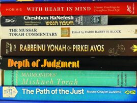 stack of books about Mussar