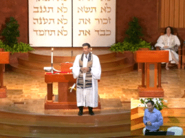 Video still of Rabbi Miller on bimah during Rosh HaShanah