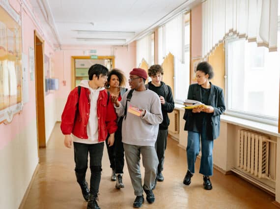 group of people walking on a hallway