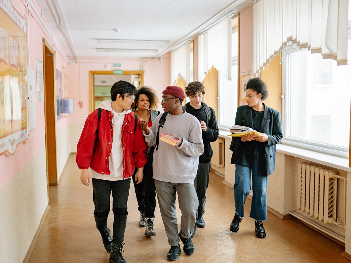 group of people walking on a hallway