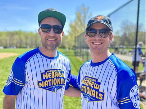 Two men in Hebrew Nationals softball uniforms