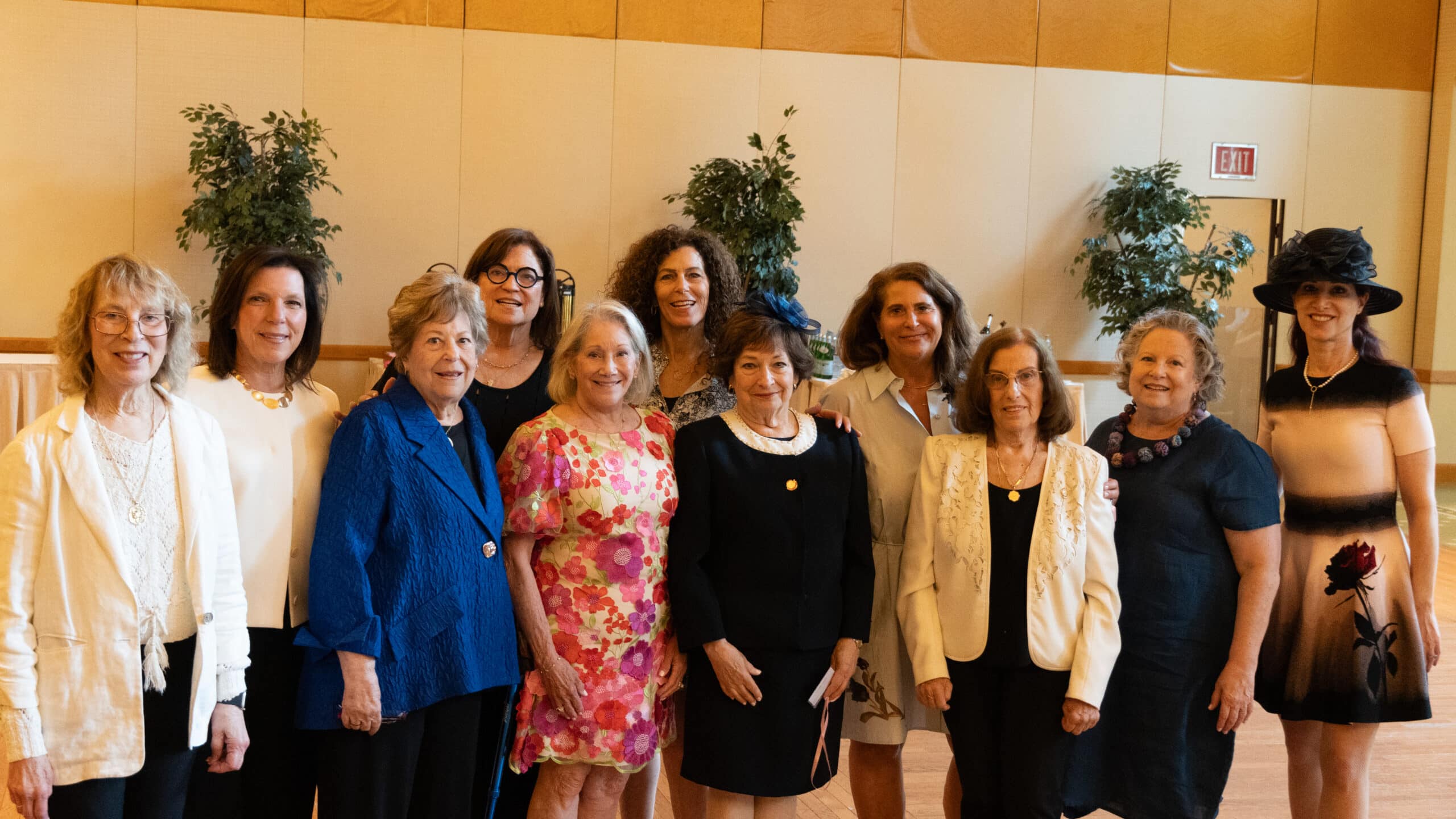 Women of WHC smiling at Luncheon event for Miss Manners