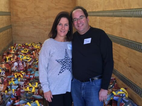Emily & Neil Kishter in delivery truck with Sunday Stuffing bags