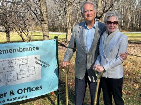 Peggy and Stan Smith hold golden shovels at the groundbreaking of the Family Welcome Center