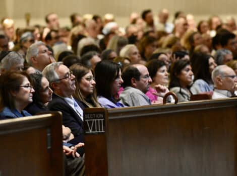 crowd of people in the seats of the sanctuary