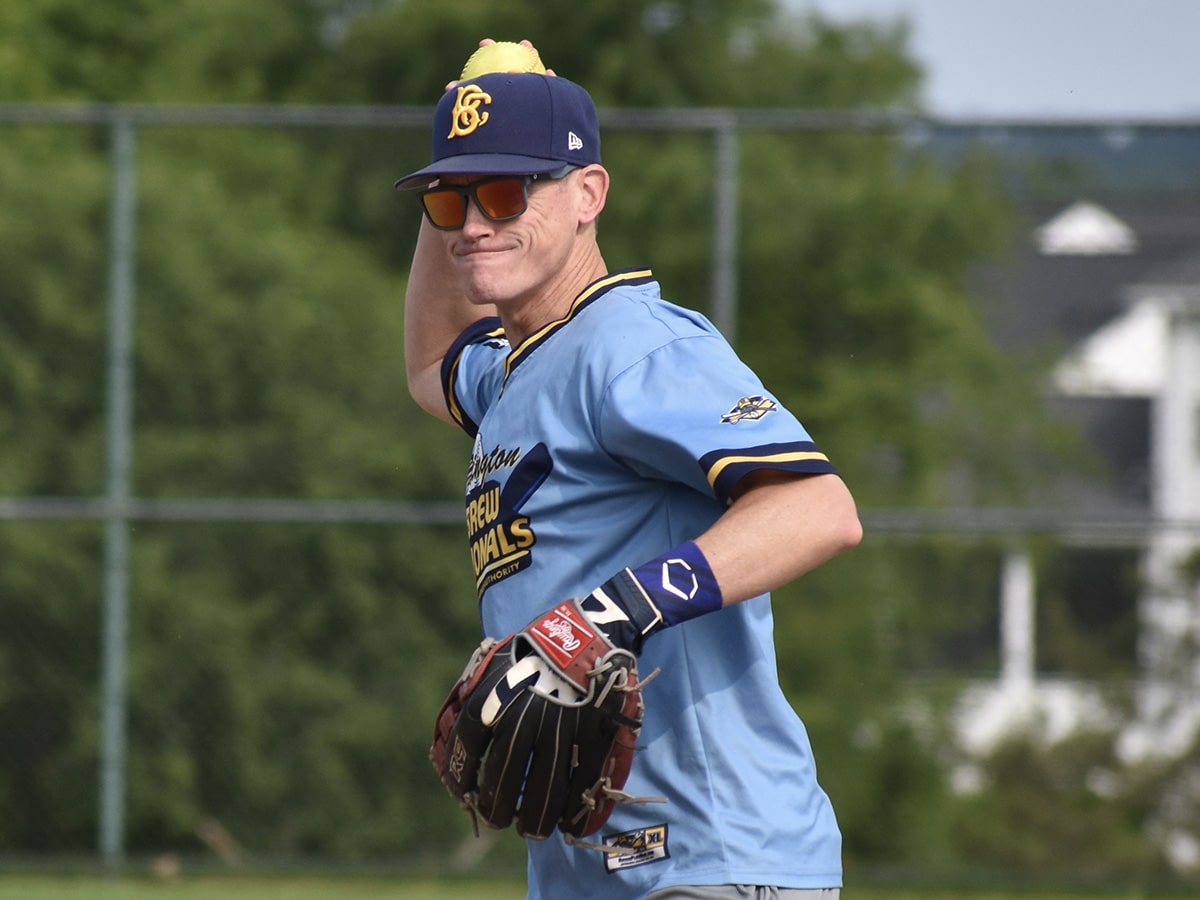 softball player prepares to make a throw